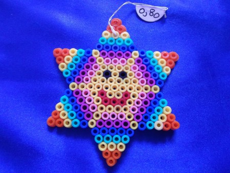 Soleil dans une étoile - 7,7 cm de largeu sur 9 cm de hauteur - Prix : 0,80 euro 